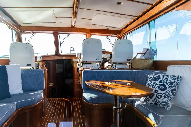 Slide: The Image of Luxurious interior of 2013 Hinckley Talaria 48 MY yacht with elegant seating and wooden finishes. - 15