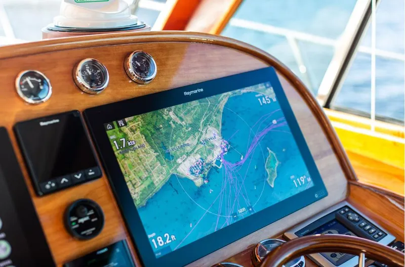 Slide: The Image of Helm of 2013 Hinckley Talaria 48 MY with navigation display. - 17