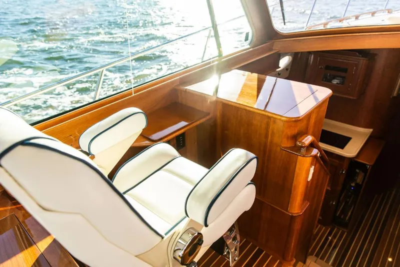 Slide: The Image of Luxurious interior of 2013 Hinckley Talaria 48 MY yacht with elegant seating and wood finish. - 19