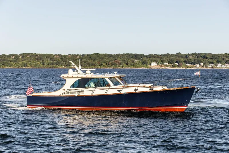 Slide: The Image of 2013 Hinckley Talaria 48 MY yacht cruising on open water. - 2