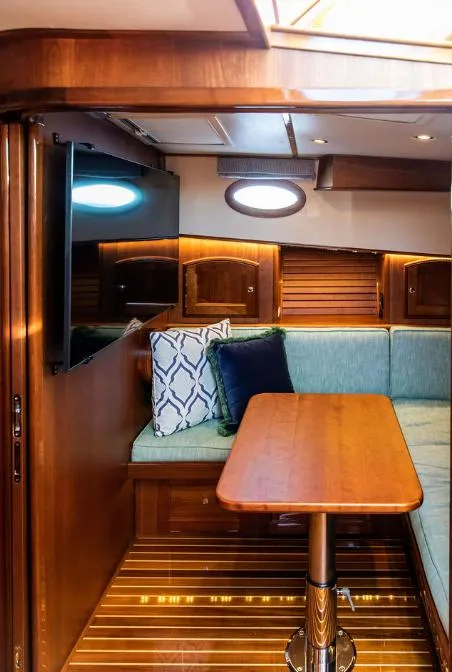 Slide: The Image of Interior of 2013 Hinckley Talaria 48 MY yacht with wood finish and cozy seating area. - 26