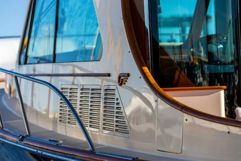 Slide: The Image of 2013 Hinckley Talaria 48 MY yacht, showcasing sleek design and polished wood accents. - 31