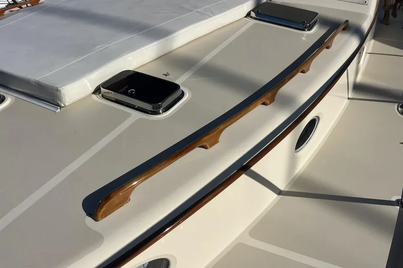 Slide: The Image of 2013 Hinckley Talaria 48 MY yacht deck with wooden rail and hatch. - 36