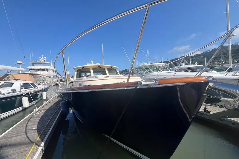 Slide: The Image of 2013 Hinckley Talaria 48 MY yacht docked at marina under clear blue sky. - 40