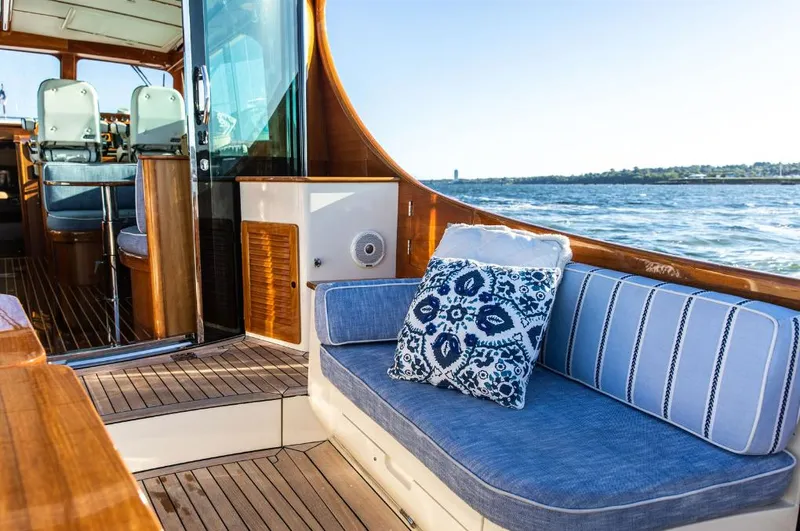 Slide: The Image of Hinckley Talaria 48 MY 2013 yacht interior with blue seating and ocean view. - 6