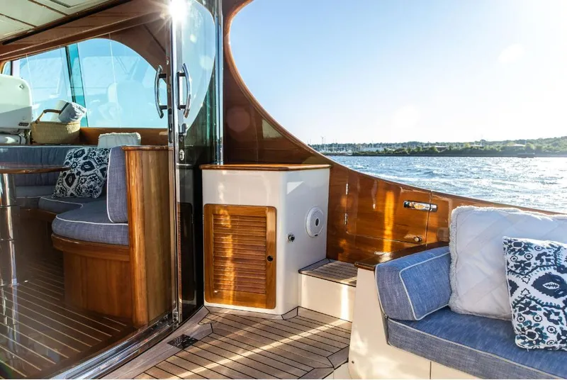 Slide: The Image of Luxurious 2013 Hinckley Talaria 48 MY yacht interior with elegant wood and plush seating. - 7