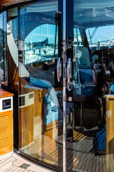 Slide: The Image of 2013 Hinckley Talaria 48 MY yacht with glass doors and luxurious interior. - 8