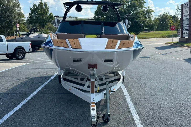 Slide: The Image of 2022 Moomba Makai boat on trailer in parking lot, front view. - 2