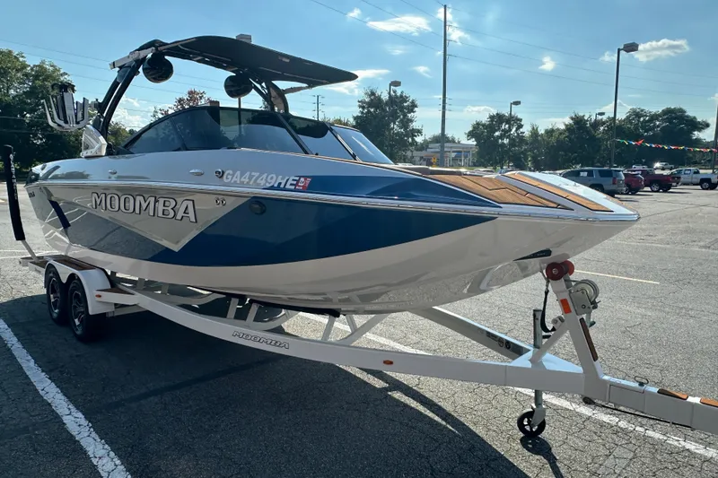 Slide: The Image of 2022 Moomba Makai boat on trailer in parking lot, sunny day. - 3