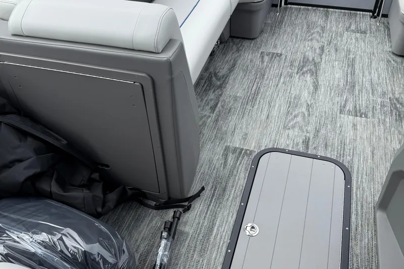 Slide: The Image of Interior of 2026 Qwest Splash Pad E-Class boat with modern seating and flooring. - 4