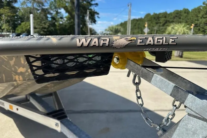 Slide: The Image of 2026 War Eagle 754LDSV boat on trailer, showcasing logo and design details. - 4