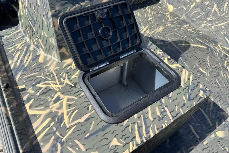 Slide: The Image of Open storage compartment on 2026 War Eagle 754LDSV boat with camouflage pattern. - 8