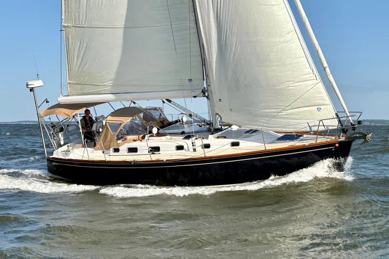 The Image of 2007 Tartan 3700 CCR sailboat navigating ocean waves under full sail. - 0