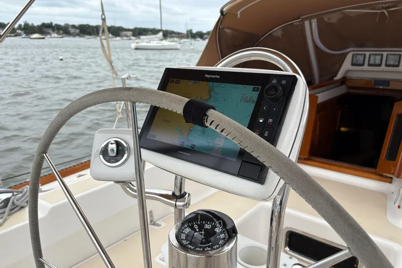 Slide: The Image of 2007 Tartan 3700 CCR sailboat cockpit with navigation equipment and compass. - 11