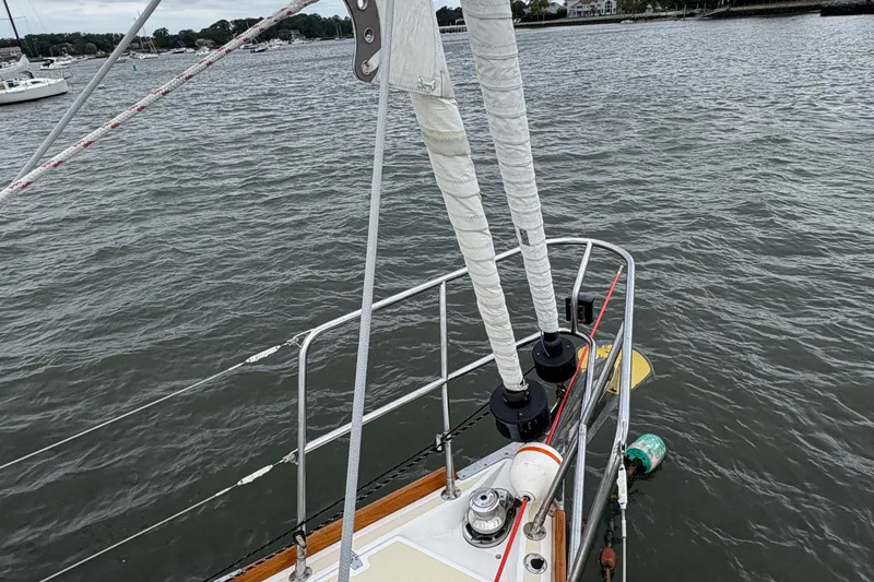 Slide: The Image of Sailboat Tartan 3700 CCR, 2007 model, on calm waters with visible rigging. - 13