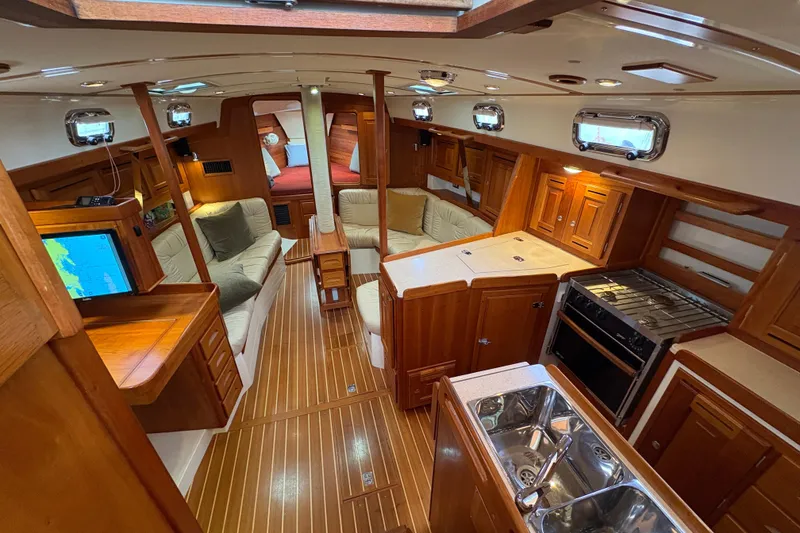 Slide: The Image of Luxurious interior of 2007 Tartan 3700 CCR yacht with wood finish and modern amenities. - 19