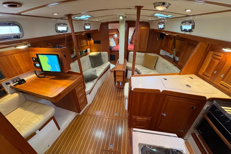 Slide: The Image of Luxurious 2007 Tartan 3700 CCR yacht interior with wood finish and modern amenities. - 20