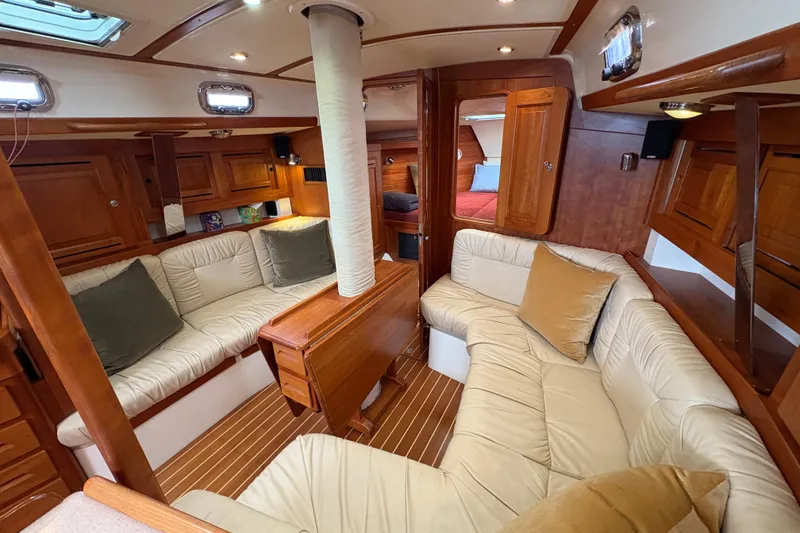 Slide: The Image of Luxurious interior of 2007 Tartan 3700 CCR yacht with plush seating and wooden accents. - 22