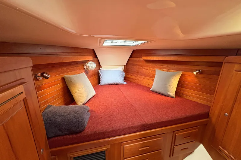 Slide: The Image of Cozy cabin interior of 2007 Tartan 3700 CCR sailboat with wooden finish and skylight. - 24