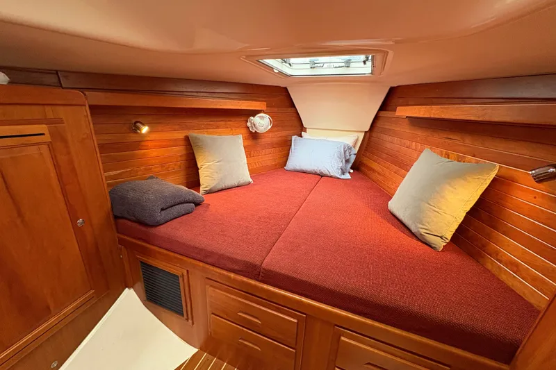 Slide: The Image of Cozy cabin interior of 2007 Tartan 3700 CCR sailboat with wooden paneling and skylight. - 25