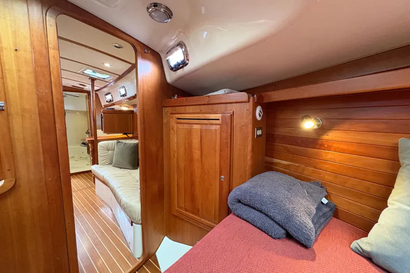 Slide: The Image of Cozy interior of 2007 Tartan 3700 CCR sailboat with wooden finishes and comfortable seating. - 26