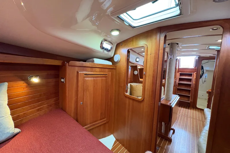 Slide: The Image of 2007 Tartan 3700 CCR yacht interior with wooden finish and cozy cabin space. - 27