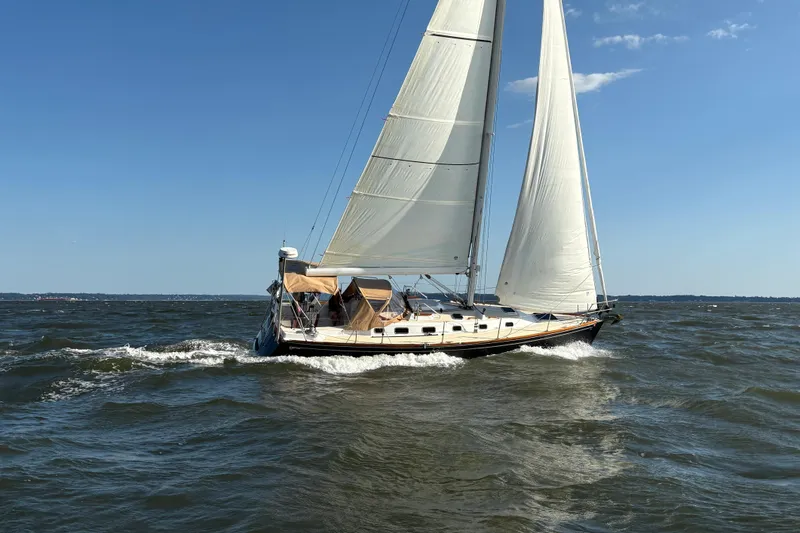 Slide: The Image of Sailing yacht Tartan 3700 CCR 2007 navigating choppy waters under clear blue sky. - 3