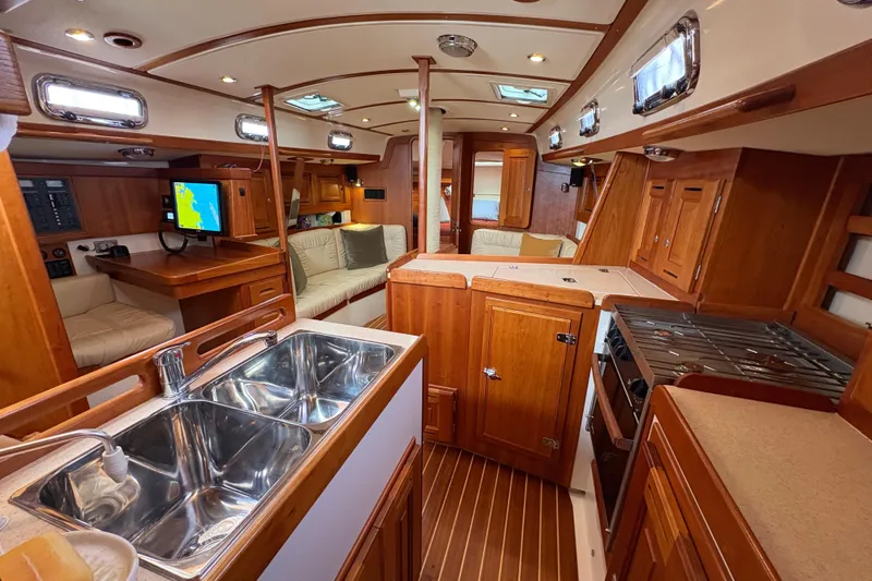 Slide: The Image of Luxurious 2007 Tartan 3700 CCR yacht interior with wood finish and modern amenities. - 32