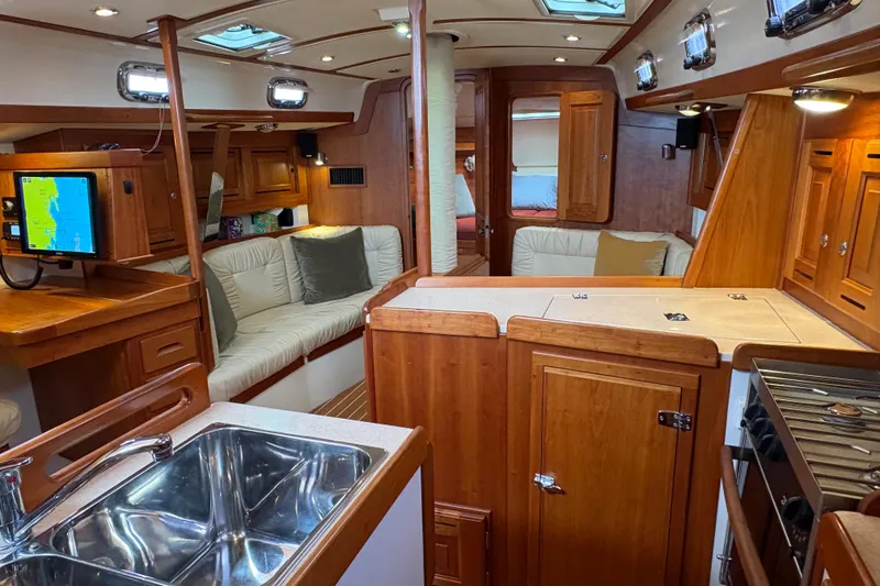 Slide: The Image of Luxurious interior of 2007 Tartan 3700 CCR sailboat with wood finish and modern amenities. - 33