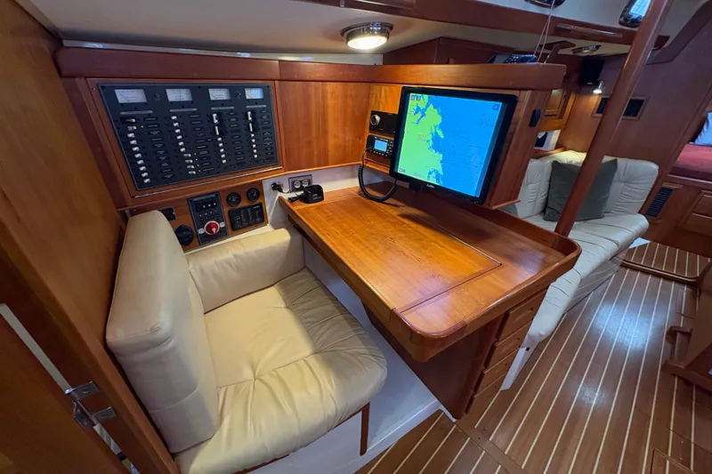 Slide: The Image of Navigation station in 2007 Tartan 3700 CCR yacht with control panel and map display. - 34