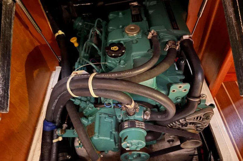 Slide: The Image of Engine compartment of a 2007 Tartan 3700 CCR sailboat, showcasing detailed mechanical components. - 40