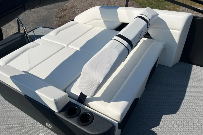 Slide: The Image of Luxurious white seating on 2026 Evotti 725CS boat, featuring adjustable backrest and cup holders. - 13