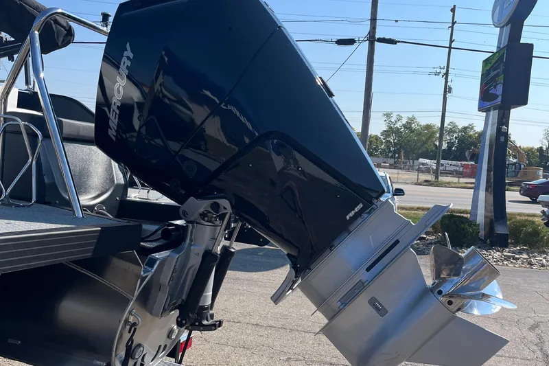 Slide: The Image of Outboard motor on Evotti 725CS boat, 2026 model, parked outdoors. - 19