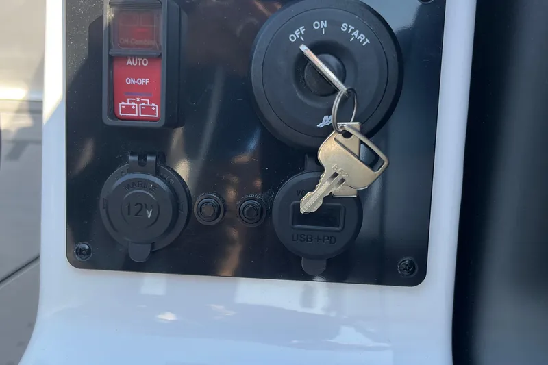 Slide: The Image of Control panel of Evotti 725CS 2026 with ignition key and power outlets. - 21