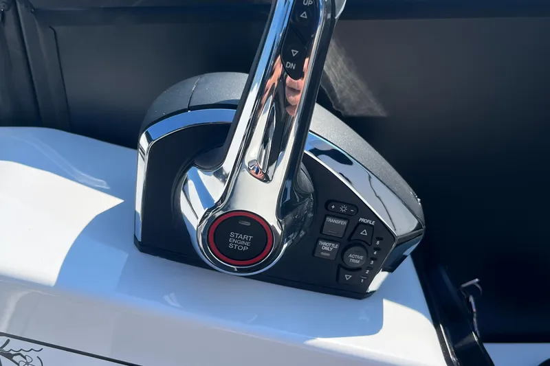 Slide: The Image of Evotti 725CS 2026 boat throttle control with start/stop button and various function switches. - 24