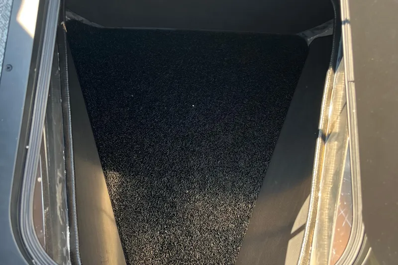 Slide: The Image of Trunk interior of 2026 Evotti 725CS with black carpet lining. - 3