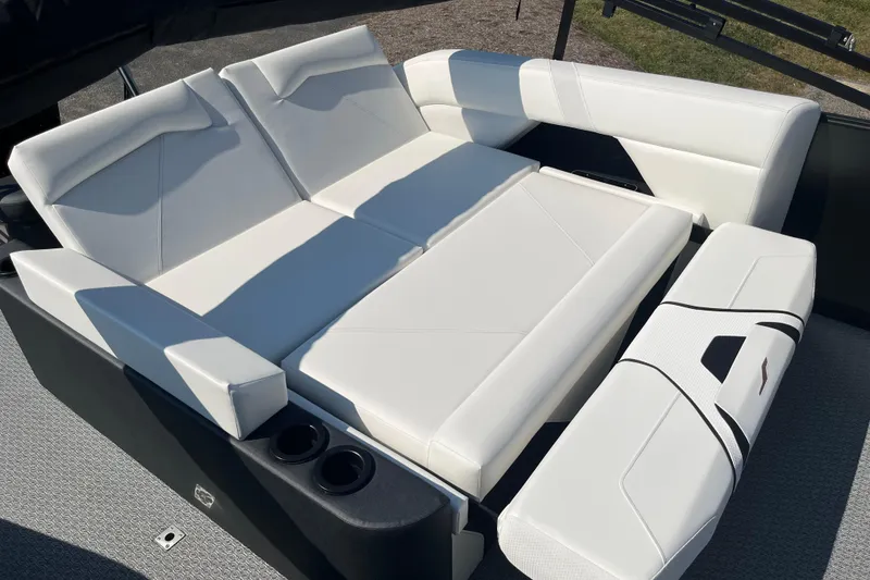 Slide: The Image of Luxurious white seating on 2026 Evotti 725CS boat, featuring modern design and cup holders. - 5