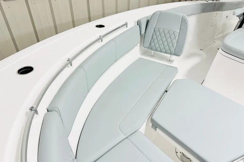 Slide: The Image of 2026 Sportsman Heritage 321 Center Console boat interior with light gray seating and modern design. - 11
