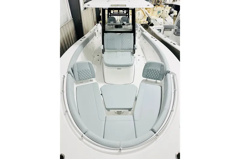 Slide: The Image of 2026 Sportsman Heritage 321 Center Console boat with spacious seating and modern design. - 12