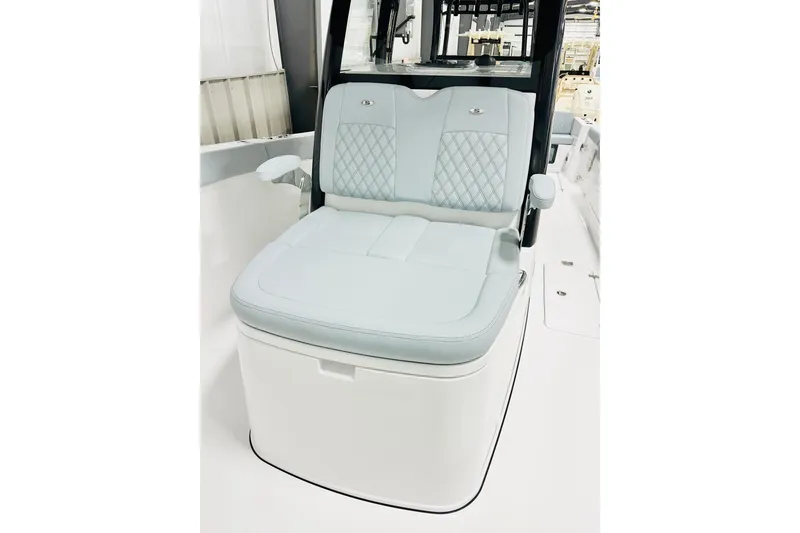 Slide: The Image of 2026 Sportsman Heritage 321 Center Console boat seat with quilted design and armrests. - 13
