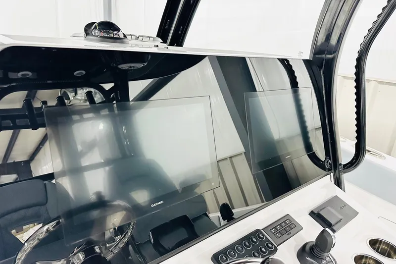 Slide: The Image of 2026 Sportsman Heritage 321 Center Console dashboard with modern navigation displays. - 3