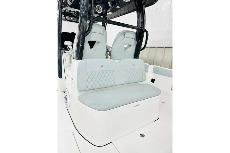 Slide: The Image of 2026 Sportsman Heritage 321 Center Console boat interior with stylish seating and modern design. - 6