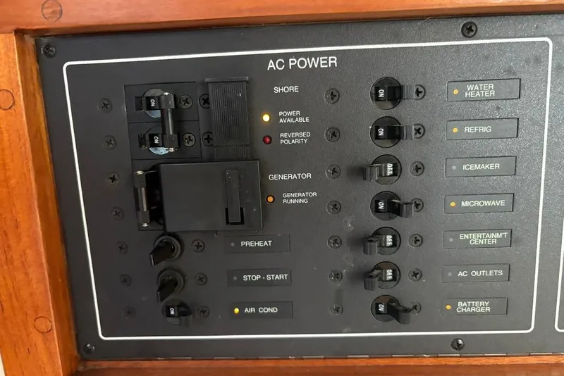 Slide: The Image of AC power control panel on a 2006 Carolina Classic 32 boat. - 15