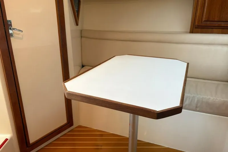 Slide: The Image of Interior of 2006 Carolina Classic 32 boat with table and seating area. - 22