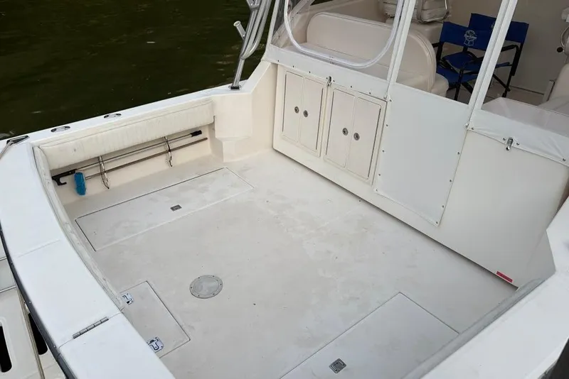 Slide: The Image of 2006 Carolina Classic 32 boat deck with storage compartments and seating. - 29