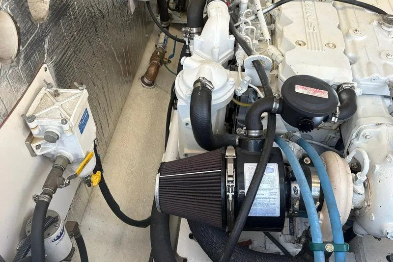 Slide: The Image of Engine compartment of a 2006 Carolina Classic 32 boat, showcasing detailed mechanical components. - 31