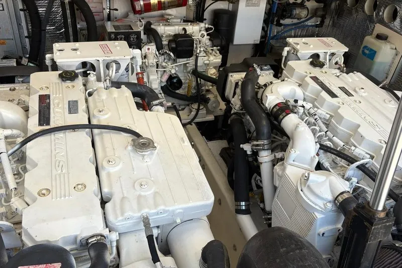 Slide: The Image of Engine room of a 2006 Carolina Classic 32 boat with twin Cummins engines. - 37