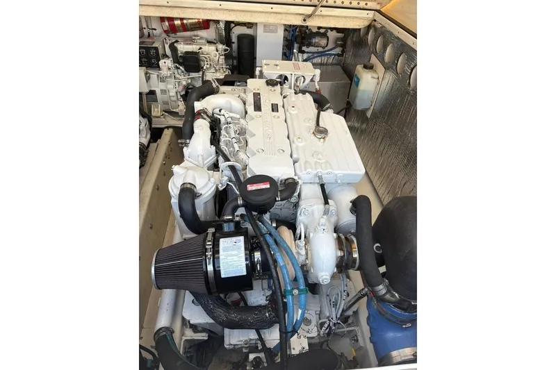 Slide: The Image of Engine compartment of a 2006 Carolina Classic 32 boat, showcasing detailed machinery. - 39