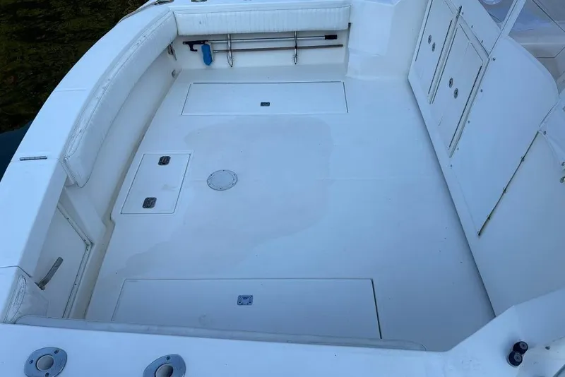 Slide: The Image of 2006 Carolina Classic 32 boat deck with storage compartments and seating. - 4