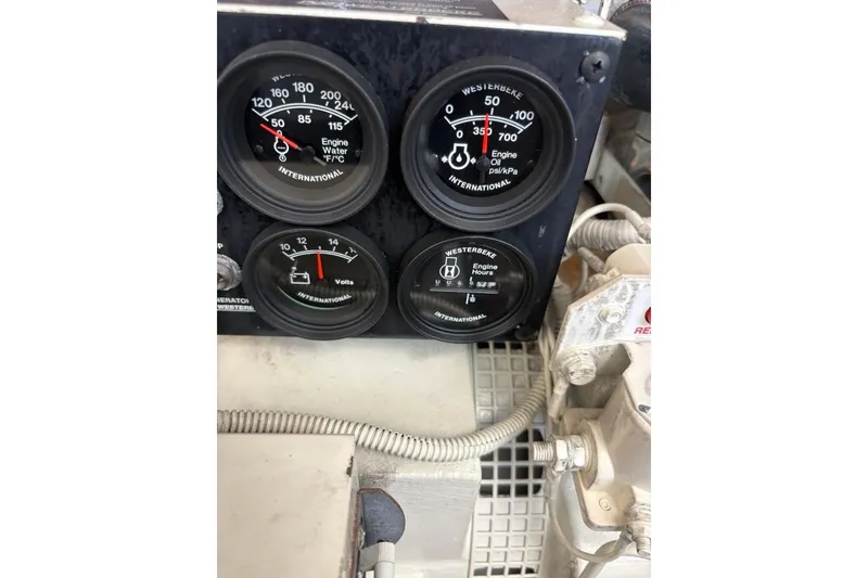 Slide: The Image of 2006 Carolina Classic 32 engine gauges displaying temperature, oil pressure, voltage, and engine hours. - 40